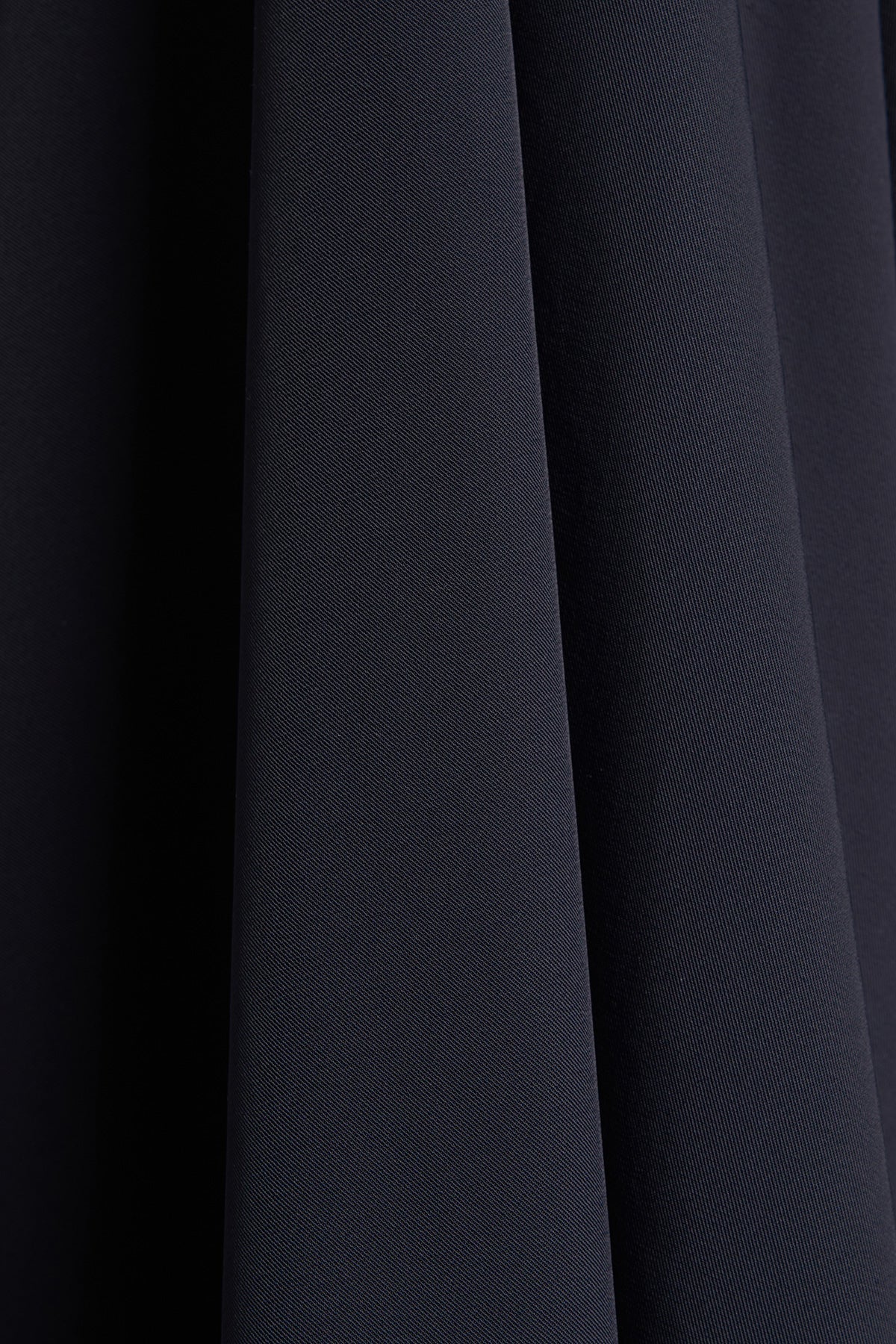 Close-up of dark blue fabric with a subtle texture