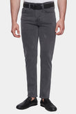 Person wearing gray pants with a white background