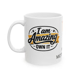 White mug with 'I am Amazing, Own It' text design on a white background