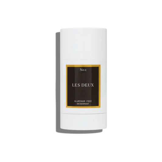White deodorant stick with 'Les Deux' branding on a white background