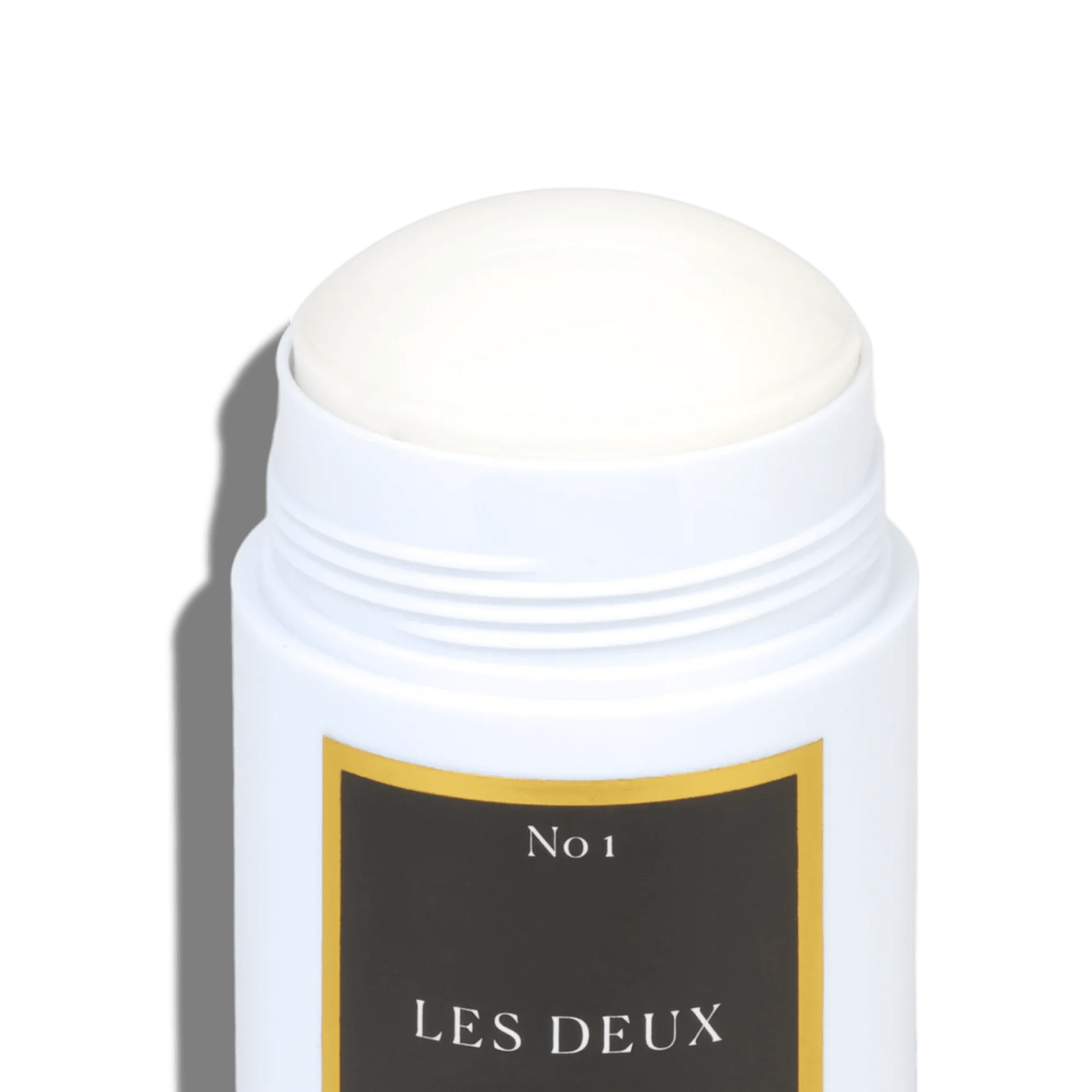 White cylindrical container with a black label featuring 'No 1 LES DEUX' on a white background