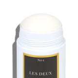 White cylindrical container with a black label featuring 'No 1 LES DEUX' on a white background