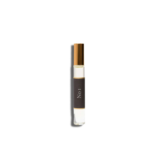 Small bottle with a gold cap and black label on a white background