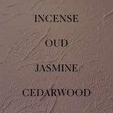 Text on a textured beige background with scents listed: Incense, Oud, Jasmine, Cedarwood.
