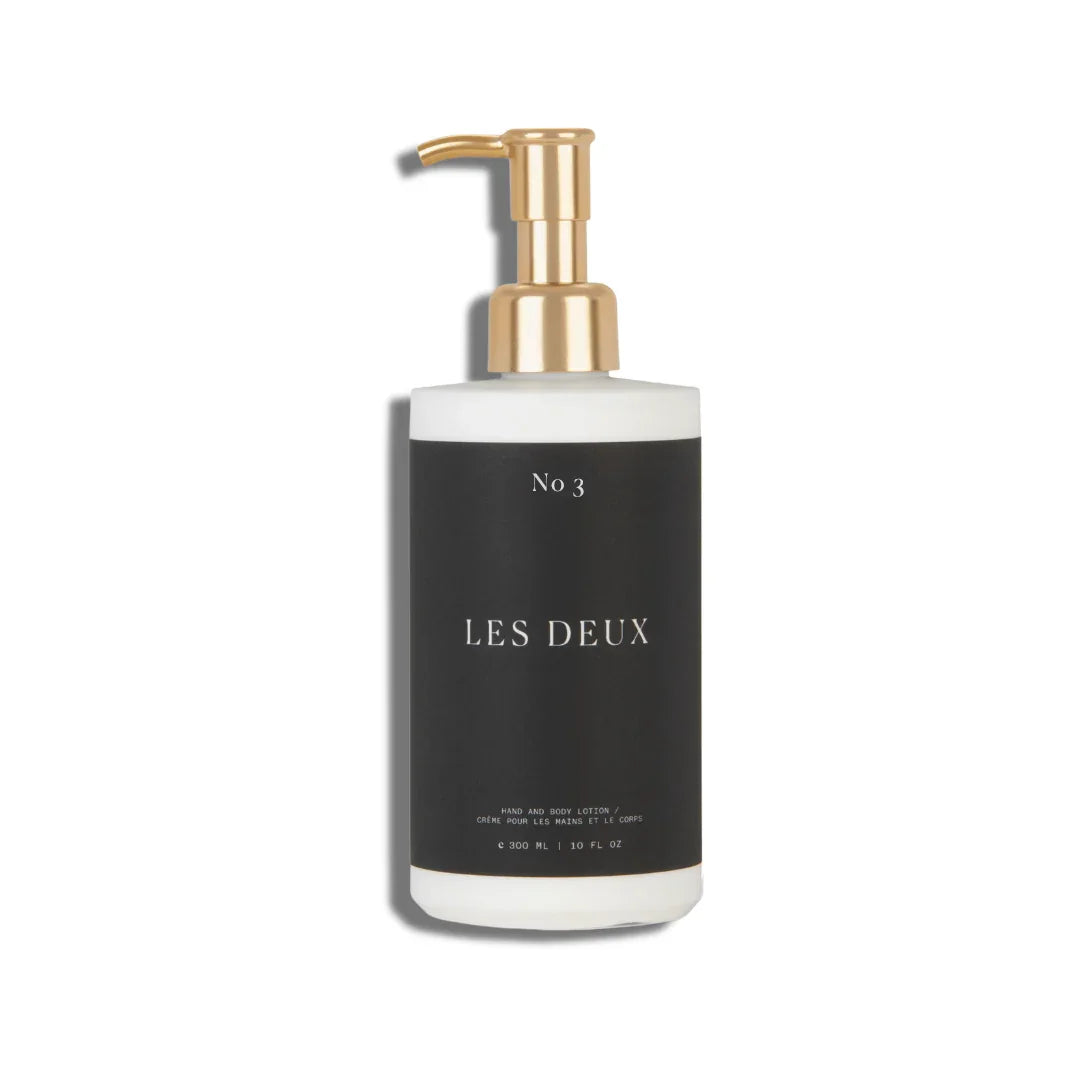 Bottle of 'Les Deux' with a pump dispenser on a white background