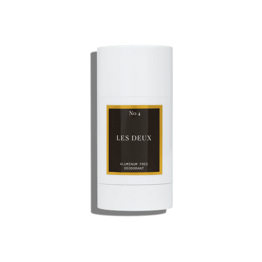 White deodorant stick with 'Les Deux' branding on a white background