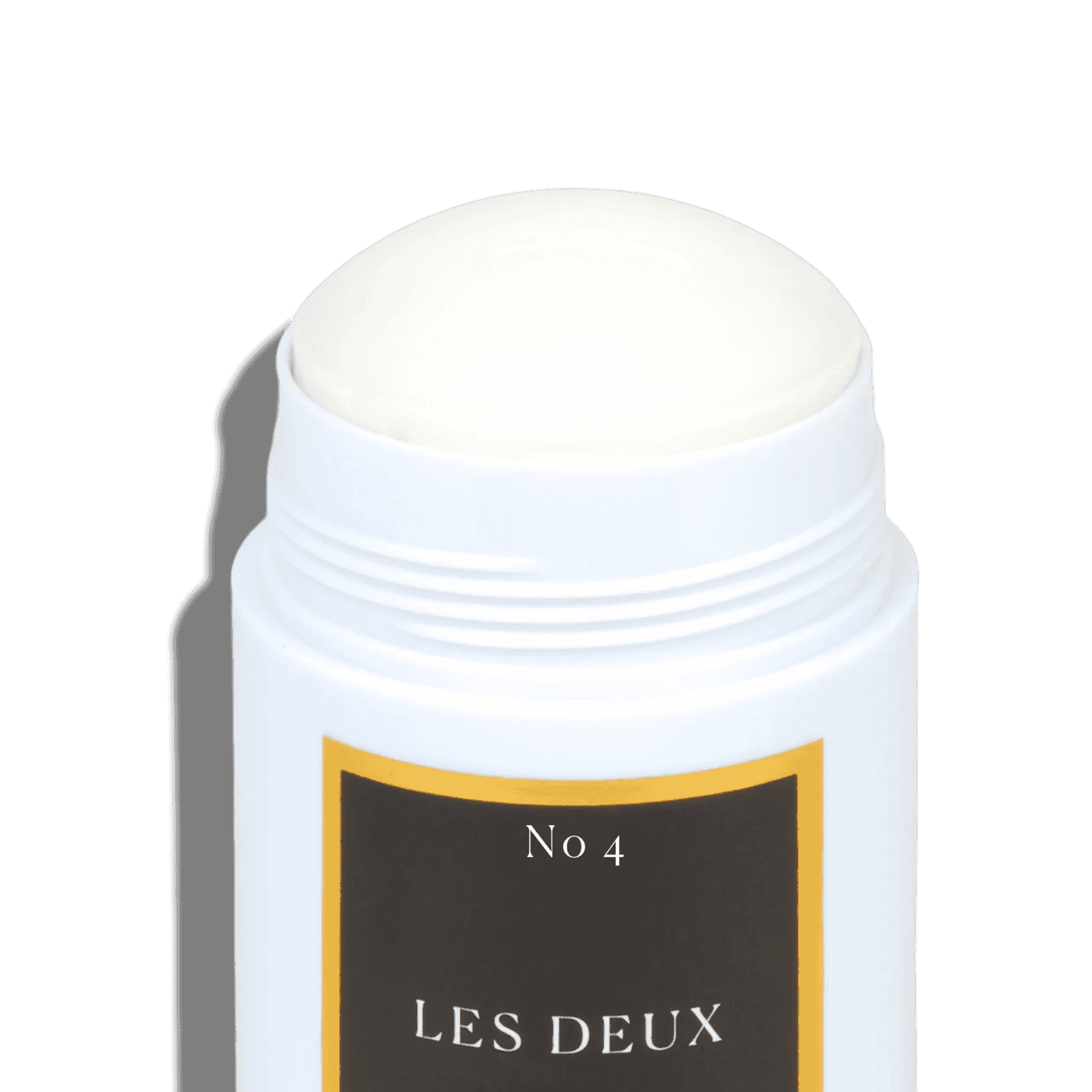 White deodorant stick with a black and gold label on a gray background