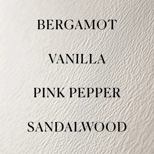 Text listing Bergamot, Vanilla, Pink Pepper, and Sandalwood on a textured beige background