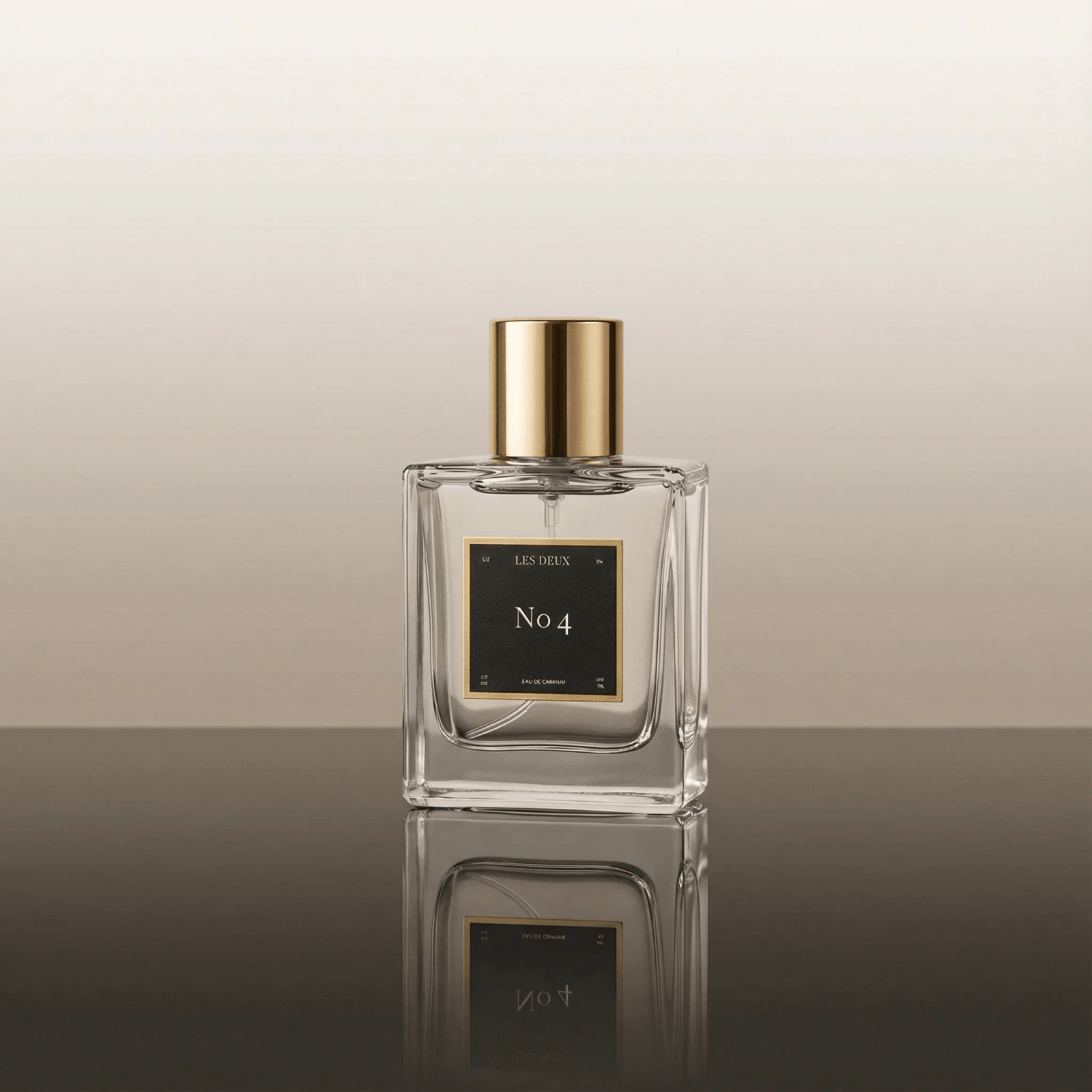 Perfume bottle labeled 'No. 4' with gold cap on a reflective surface.