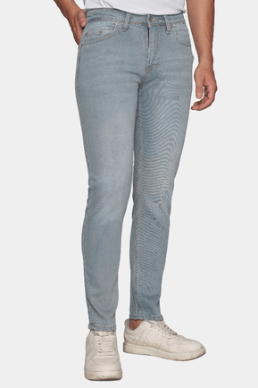 Light blue jeans worn by a person on a white background