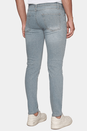 Light blue jeans worn by a person on a white background