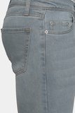 Close-up of blue jeans on a white background