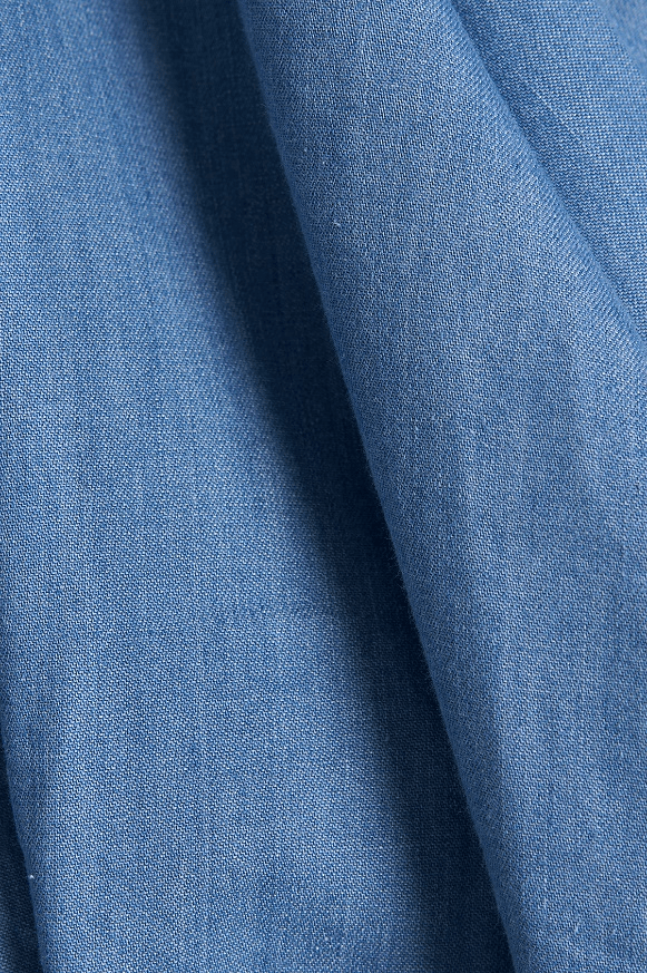 Close-up of blue fabric with a textured pattern