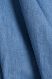 Close-up of blue fabric with a textured pattern