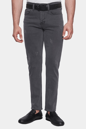 Person wearing gray pants with a black belt on a white background