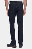 Person wearing dark blue jeans on a white background
