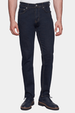 Dark blue jeans worn by a person on a white background