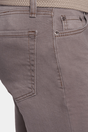 Close-up of gray pants with a belt and part of a shirt visible.