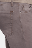 Close-up of gray pants with a belt and part of a shirt visible.